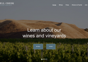 Screenshot: Shell Creek Vineyards home slider with photo of vineyard and buttons to wine and vines pages